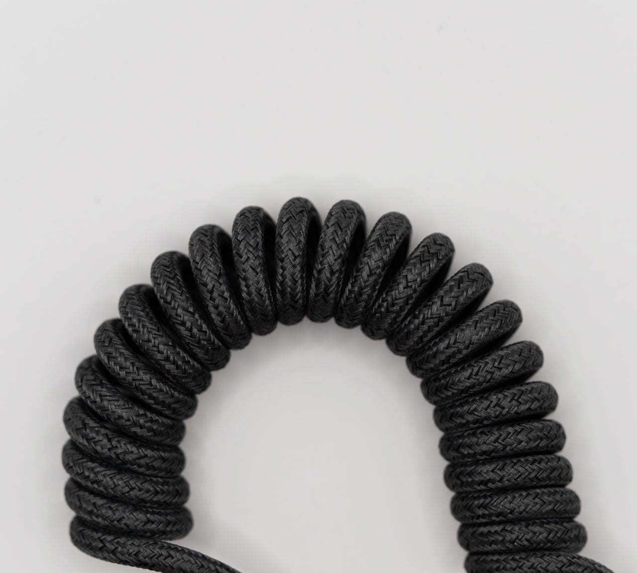 Cablu spiralat KBLU Loop cu înveliș textil împletit